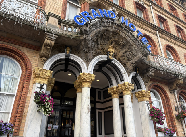 Grand Hotel Scarborough Ornate entrance to the Grand Hotel with arched doorway, marble columns, gold capitals and decorative stone carvings on the historic façade.
